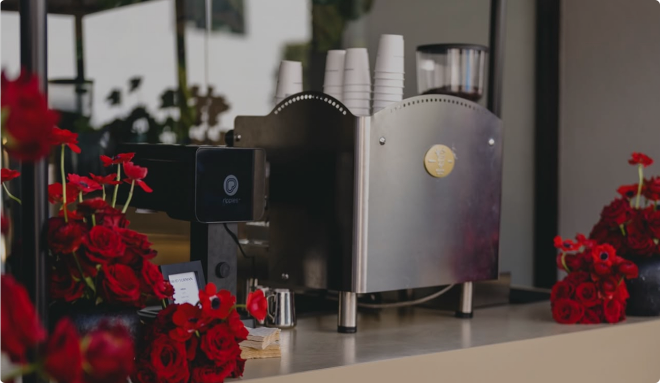 Espresso machine with red roses